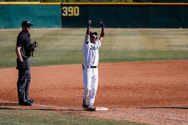Julian Francois celebrates after his stand-up triple