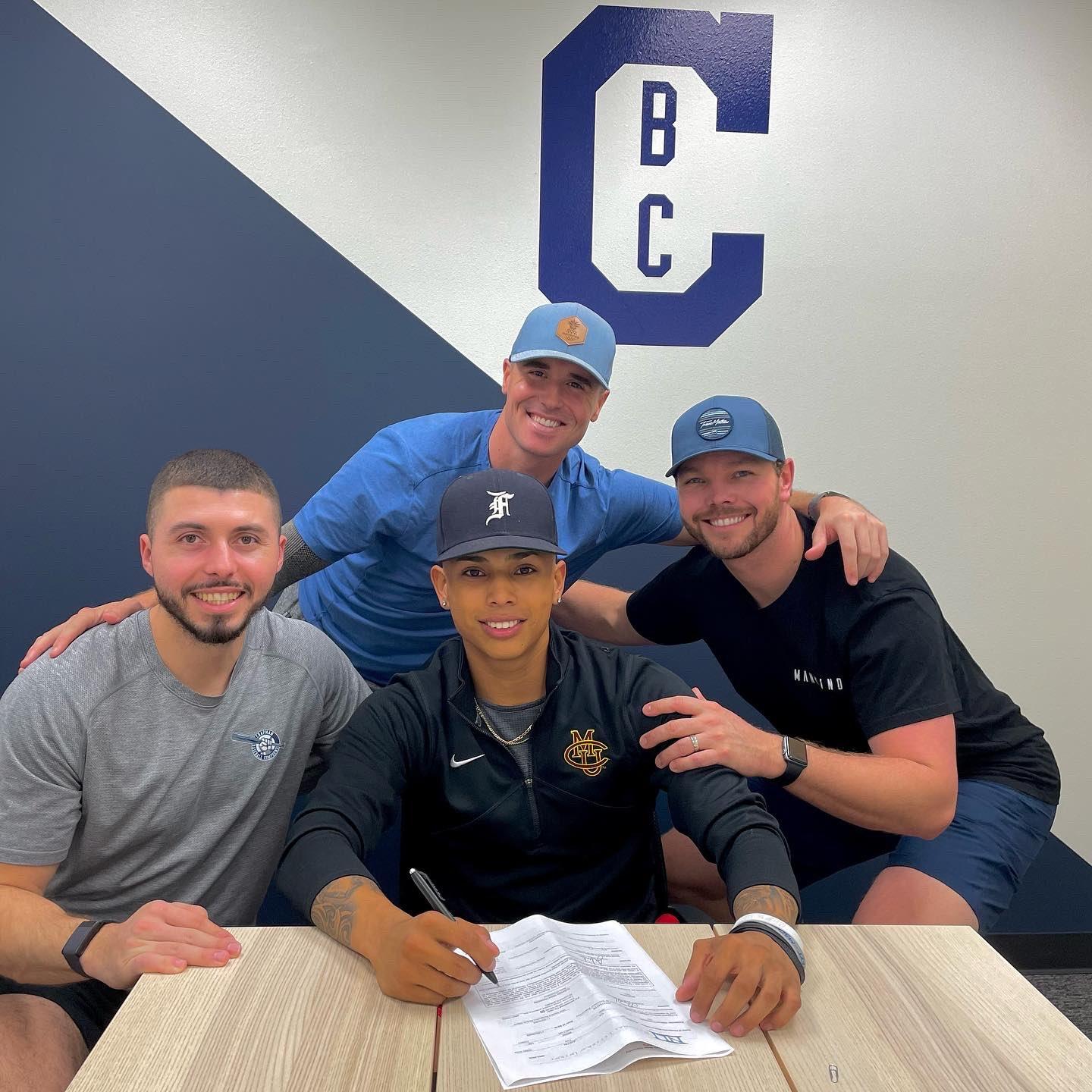 JJ Almeda (center) signed with Colorado Mesa University