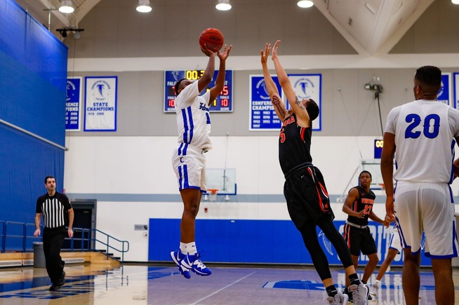 Jalen Washington gets off his game-winning shot for the Falcons