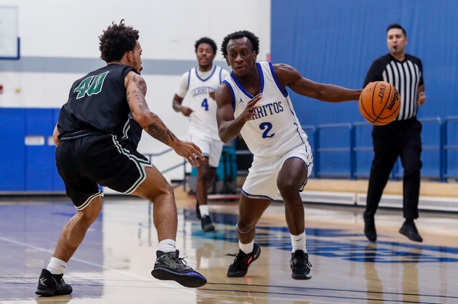 Dillon Botts drives to the hoop for two of his team-high 22 points against East LA