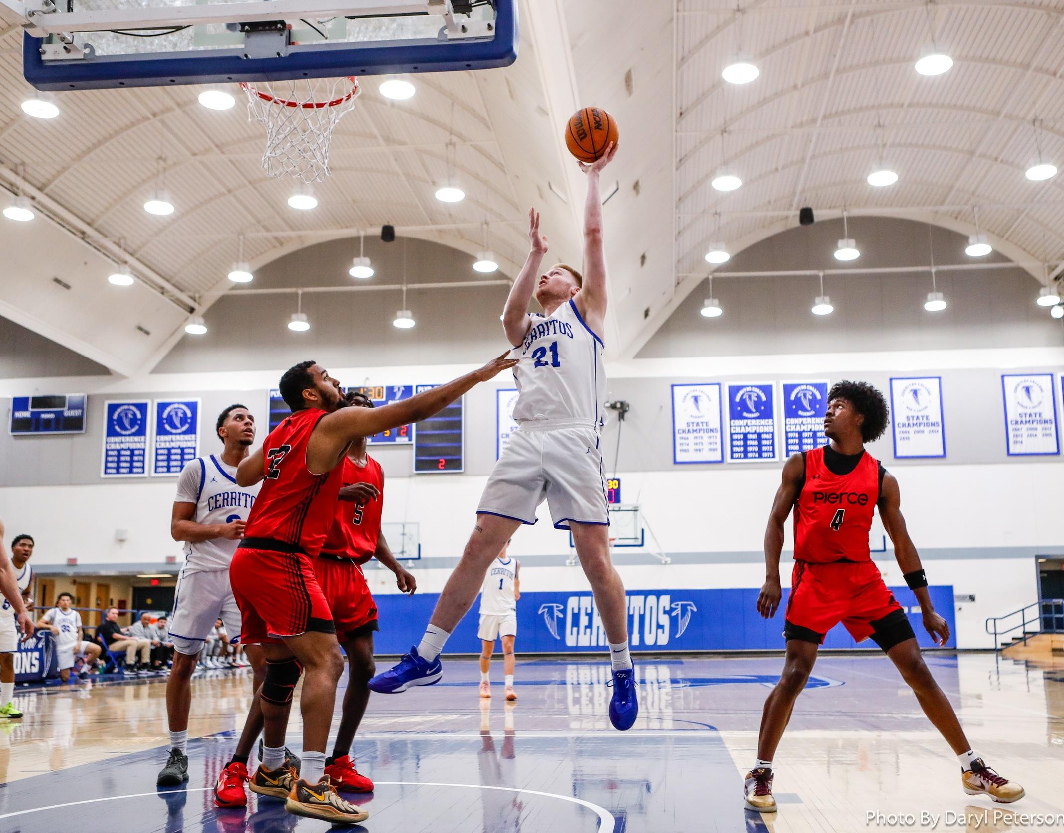 Gavin Carothers-Vukasovic (21) scores two of his seven points against LA Pierce