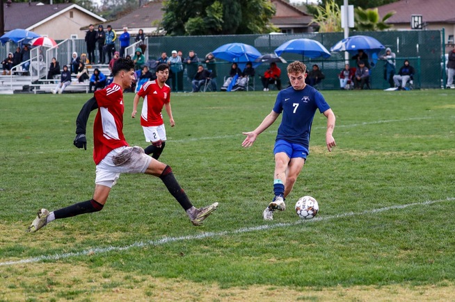 Julian Vazquez chips the ball into the net for the Falcons second goal against LB City