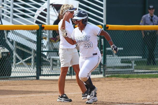 Jezeree Misaalefua is congratulated by head coach Kodee Murray after her home run
