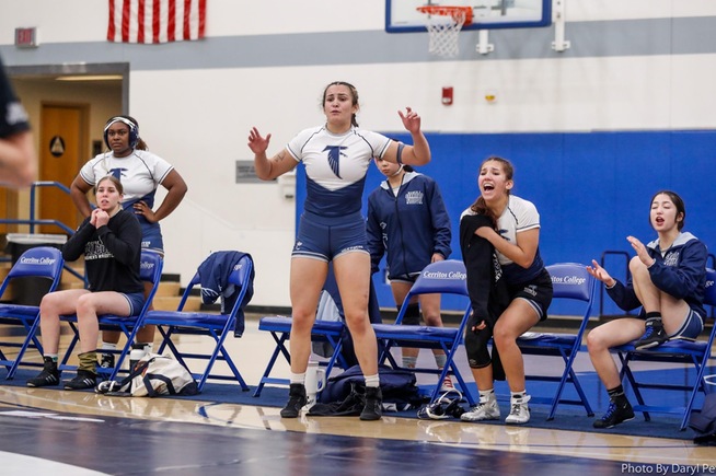Vida Beckel and the Falcons react to one of their teammates pins