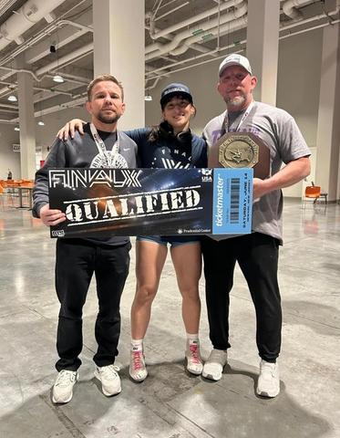Aine Drury (center) won the US Open at 65 kilograms. Falcon head coach Dustin Kirk is on the left.